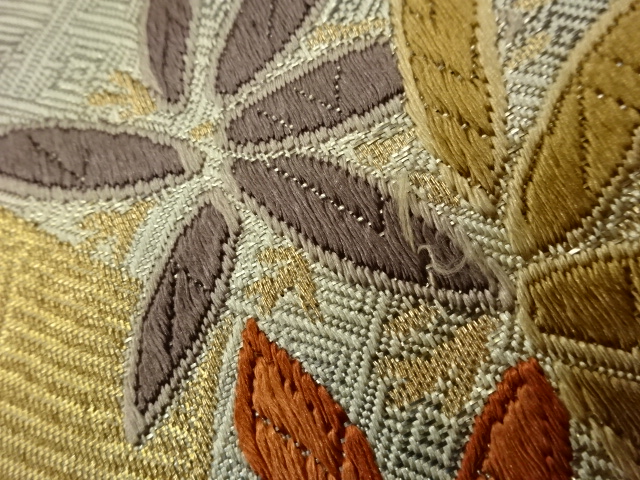  笹に蔓草・鶴・流水模様織出し袋帯